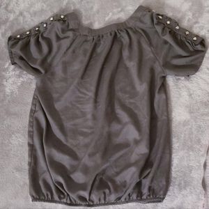 Women's size small. Metallic gray 100%polyester shirt sleeve lightweight blouse